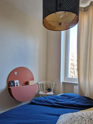 Un ou plusieurs lits dans un hébergement de l'établissement Charmant studio privatif au coeur de Lyon