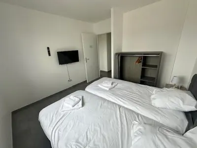 Un ou plusieurs lits dans un hébergement de l'établissement MAISON 60 avec 3 chambres lechaffardcom