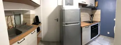 Cuisine ou kitchenette dans l'établissement La p'tite maison
