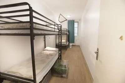 Un ou plusieurs lits dans un hébergement de l'établissement Le Flâneur Guesthouse