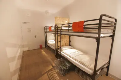 Un ou plusieurs lits dans un hébergement de l'établissement Le Flâneur Guesthouse