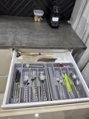 Cuisine ou kitchenette dans l'établissement Appartement d exeption neuf idealement situe proche Eurexpo OL vallee et Lyon centre parking gratuit