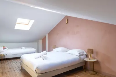 Un ou plusieurs lits dans un hébergement de l'établissement Maison d'exception au coeur de Lyon avec piscine