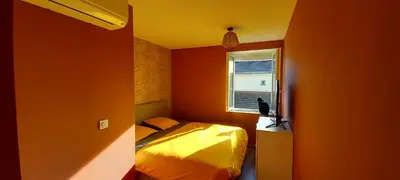 Un ou plusieurs lits dans un hébergement de l'établissement Jonage House