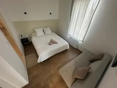 Un ou plusieurs lits dans un hébergement de l'établissement Appartement cosy à côté du métro