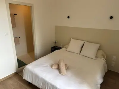 Un ou plusieurs lits dans un hébergement de l'établissement Appartement cosy à côté du métro