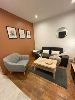 Coin salon dans l'établissement Le Cosy Grange Blanche - 2 chambres