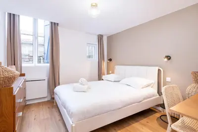 Un ou plusieurs lits dans un hébergement de l'établissement La Maison Bretzel & SPA Medipole