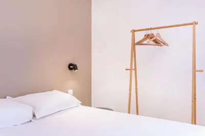 Un ou plusieurs lits dans un hébergement de l'établissement La Maison Bretzel & SPA Medipole