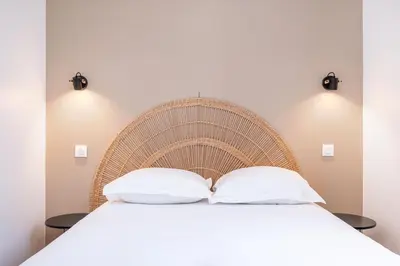Un ou plusieurs lits dans un hébergement de l'établissement La Maison Bretzel & SPA Medipole