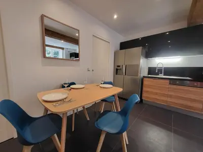 Cuisine ou kitchenette dans l'établissement New Bocuse appartement
