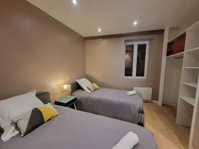 Un ou plusieurs lits dans un hébergement de l'établissement New Bocuse appartement