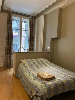 Un ou plusieurs lits dans un hébergement de l'établissement Appartement lumineux en plein coeur de Lyon