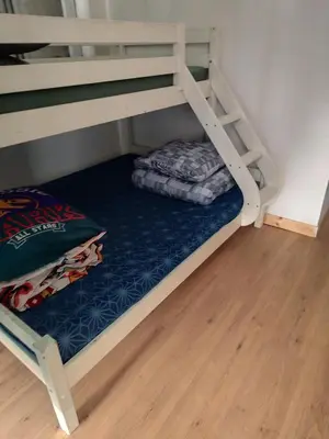 Un ou plusieurs lits dans un hébergement de l'établissement Spacieux logement pour 5 personnes
