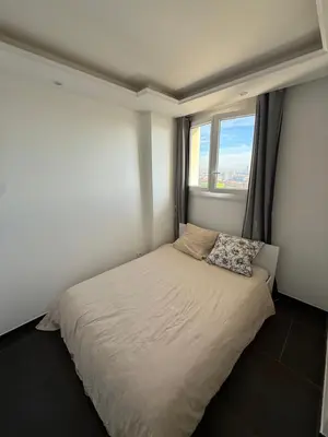 Un ou plusieurs lits dans un hébergement de l'établissement Appartement vue sur Lyon