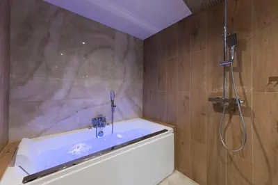 Salle de bains dans l'établissement Spa & Relaxation 15 min de Lyon - Noomi Suite