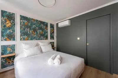 Un ou plusieurs lits dans un hébergement de l'établissement Spa & Relaxation 15 min de Lyon - Noomi Suite