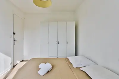 Un ou plusieurs lits dans un hébergement de l'établissement Appartement de charme, proche de toutes commonidités