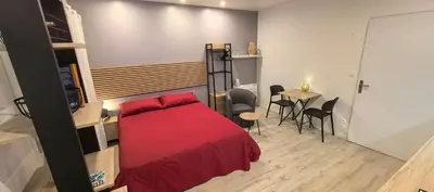 Un ou plusieurs lits dans un hébergement de l'établissement Studio cosy indépendant