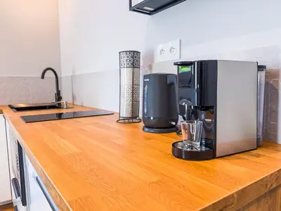 Cuisine ou kitchenette dans l'établissement SERENITY - Côté cour
