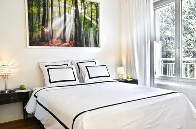 Un ou plusieurs lits dans un hébergement de l'établissement Chambre spacieuse et calme, chez Citizen Q
