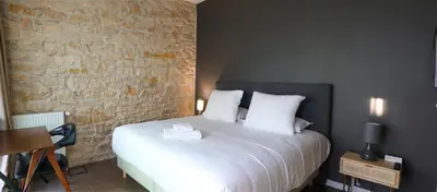 Un ou plusieurs lits dans un hébergement de l'établissement Hôtel Séquoias