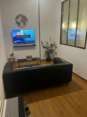 Télévision ou salle de divertissement dans l'établissement Douce escale