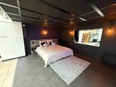 Un ou plusieurs lits dans un hébergement de l'établissement Loft Des Sens