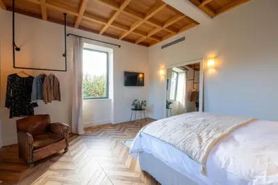Un ou plusieurs lits dans un hébergement de l'établissement La Maison et l'Orangerie