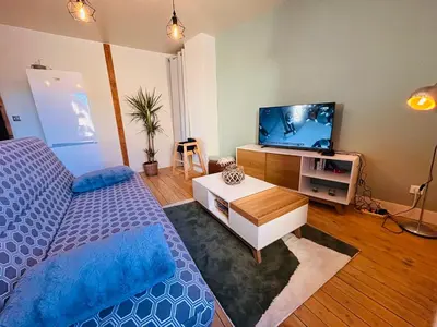 Télévision ou salle de divertissement dans l'établissement Gîte de l'auberge