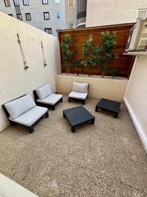 Coin salon dans l'établissement Studio Cosy et élégant avec Terrasse