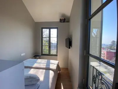Un ou plusieurs lits dans un hébergement de l'établissement Maison bohème chic de 3 suites face à la cité internationale