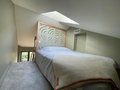 Un ou plusieurs lits dans un hébergement de l'établissement Maison bohème chic de 3 suites face à la cité internationale