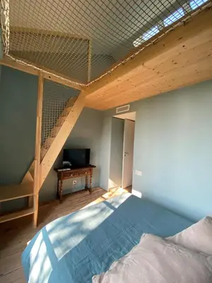 Un ou plusieurs lits dans un hébergement de l'établissement Maison bohème chic de 3 suites face à la cité internationale