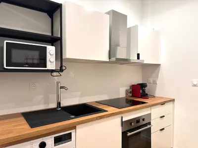 Cuisine ou kitchenette dans l'établissement L'harmonie