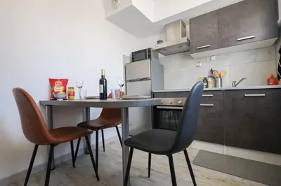 Cuisine ou kitchenette dans l'établissement La Case de Jade