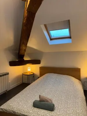 Un ou plusieurs lits dans un hébergement de l'établissement Appartement La Forêt Villebois 01