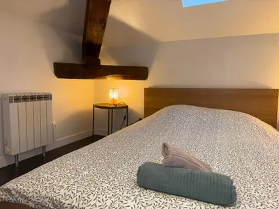 Un ou plusieurs lits dans un hébergement de l'établissement Appartement La Forêt Villebois 01