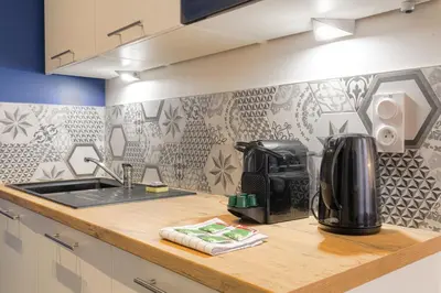 Cuisine ou kitchenette dans l'établissement Caractère et Charmant en Hypercentre