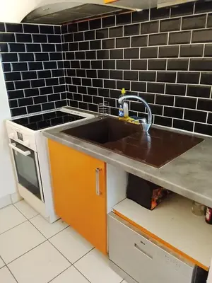 Cuisine ou kitchenette dans l'établissement Appartement T2