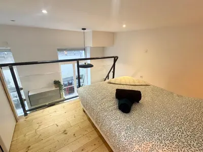 Un ou plusieurs lits dans un hébergement de l'établissement Jubin Duplex
