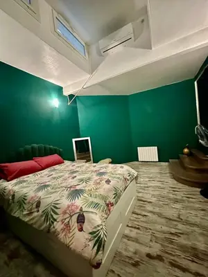 Un ou plusieurs lits dans un hébergement de l'établissement APPARTEMENT Centre Ville