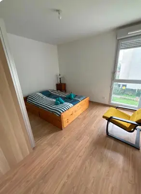 Un ou plusieurs lits dans un hébergement de l'établissement Un appartement dans un coin tranquille