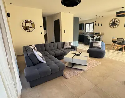 Coin salon dans l'établissement Maison au calme à Pont-Évêque
