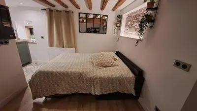 Un ou plusieurs lits dans un hébergement de l'établissement La Petite Porte du Bonheur