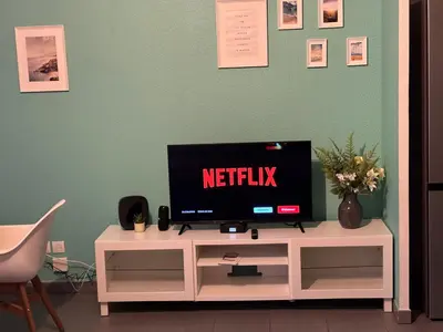 Télévision ou salle de divertissement dans l'établissement La Belle échappée