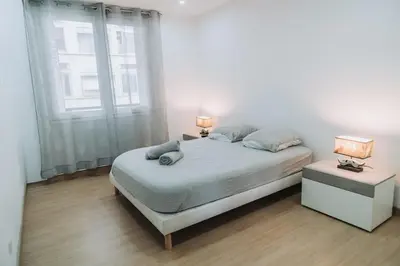 Un ou plusieurs lits dans un hébergement de l'établissement Grand T5 Villeurbanne 4 chambres idéal famille