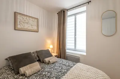 Un ou plusieurs lits dans un hébergement de l'établissement Le Mado, Charming two-room apartment in a great location