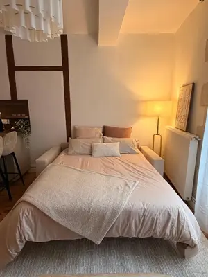 Un ou plusieurs lits dans un hébergement de l'établissement Appartement Jazz - Hyper Centre Vienne - Garage
