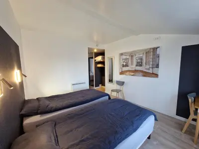 Un ou plusieurs lits dans un hébergement de l'établissement Clos Merise - appartement de 3 chambres
